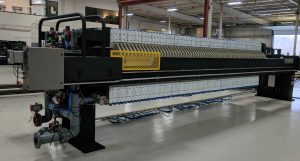 M.W. Watermark 1200mm filter press with diaphragm squeeze plates and EnduroLiner™ chemical resistant coating. Manufactured for nickel carbonate filtration and washing.