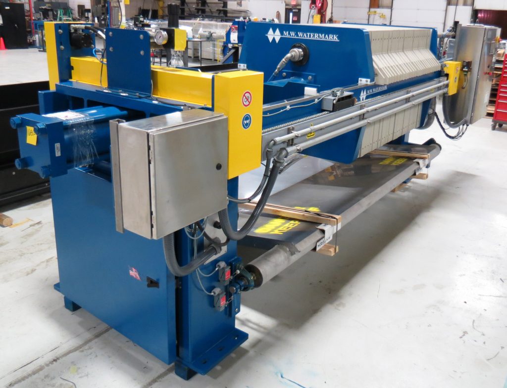 M.W. Watermark 1000mm filter press with automatic plate shifter and drip trays - manufactured for ore processing.