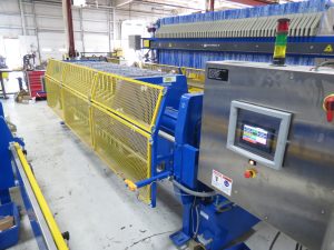 M.W. Watermark 1000mm filter press built for a concrete grinding application. Includes a plate bump mechanism for automated cake release.