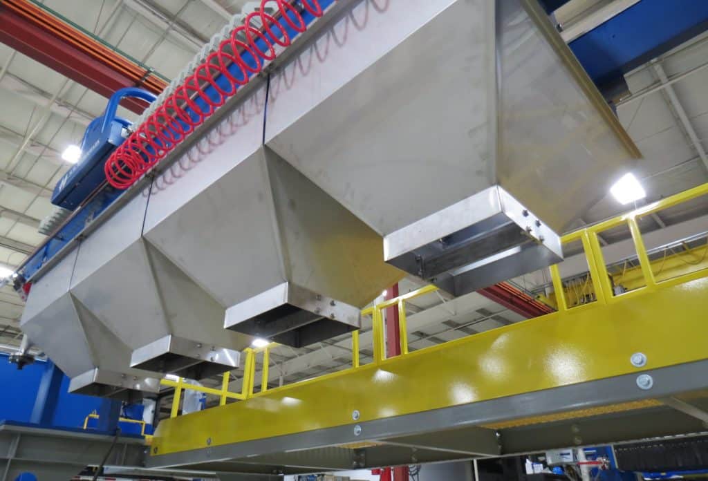 M.W. Watermark Filter Press on an Elevated Platform with a Customized Stainless Steel Discharge Chute