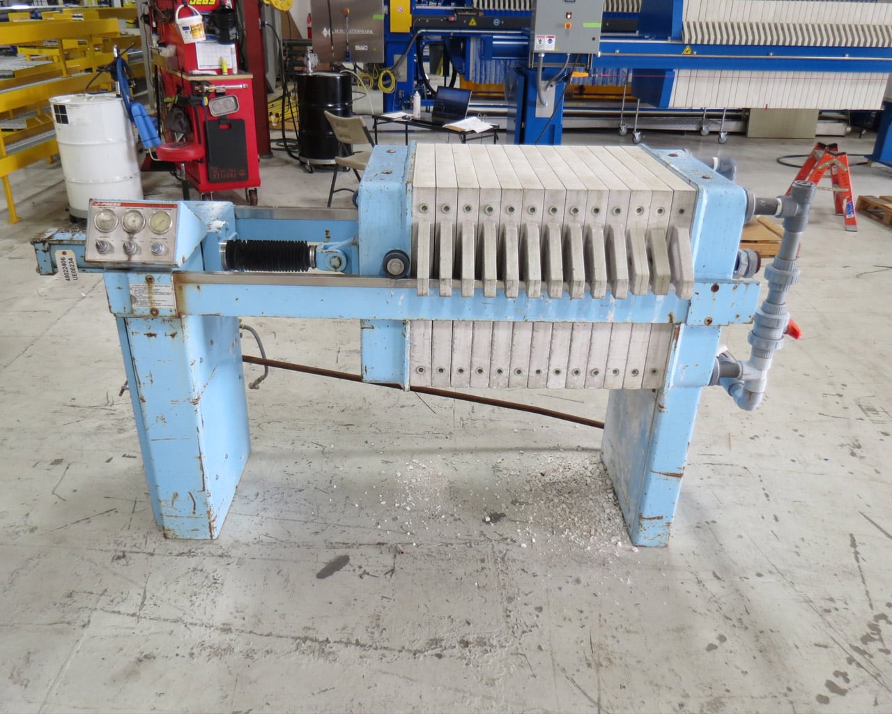 Before-shot of left hand side and controls of a light blue JWI J-Press in disrepair