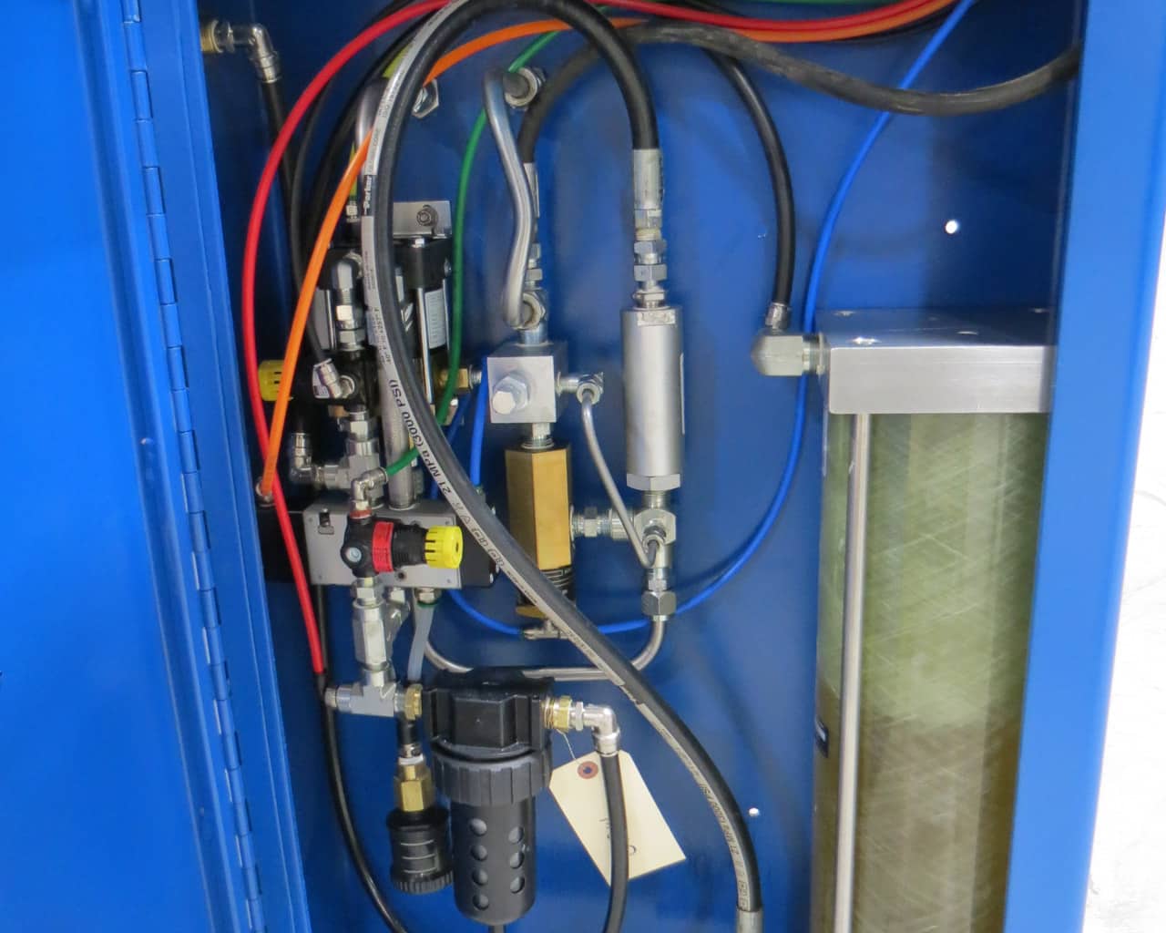 After-shot of a blue JWI J-Press hydraullic cabinet following an M.W. Watermark rebuild