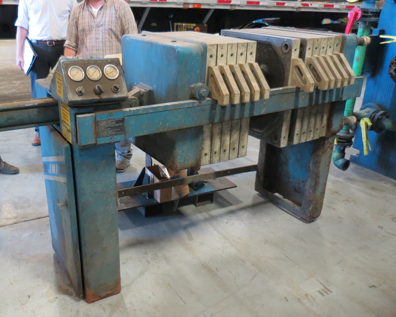 Before-shot of left hand side and controls of a blue JWI J-Press in disrepair